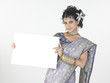 Girl with nice hairstyle holding white placard