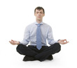 Businessman is sitting in yoga position Businessman is sitting in yoga position