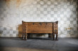an antique wooden chest of drawers in castle at a stone wall an antique wooden chest of drawers in castle at a stone wall