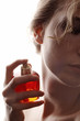 sensual woman applying perfume on her body sensual woman applying perfume on her body