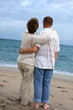 Romantic mature couple  walking at the beach