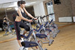 Photo: working out in the gym on a bike working out in the gym on a bike