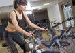 Photo: working out in the gym on a bike working out in the gym on a bike