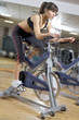 Photo: working out in the gym on a bike working out in the gym on a bike