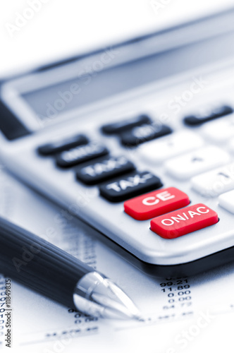 Photo: Tax calculator and pen Tax calculator and pen
