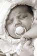 Little baby is sleeping with a soother II