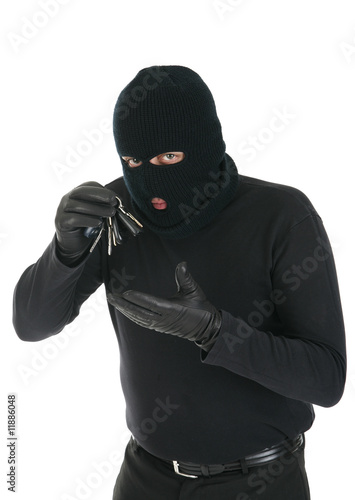 Photo: Masked criminal holding keys - Your message here Masked criminal holding keys - Your message here