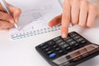 Photo: Fingers of girl press on calculator button Fingers of girl press on calculator button