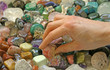 Crystal therapist choosing stones