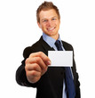 Business man handing a blank business card over white