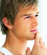 Closeup shot of a handsome young man looking away
