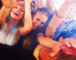 People dancing in a bar or nightclub at a party People dancing in a bar or nightclub at a party