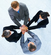 Business people with hands on top of each other