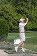 Elderly Man Practicing Golf Elderly Man Practicing Golf