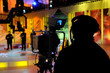 Cameraman works in the studio - recording show in TV studio