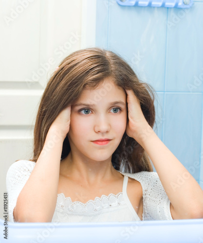 Photo: Teen girl in bathroom Teen girl in bathroom