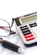 Tax calculator pen and glasses Tax calculator pen and glasses