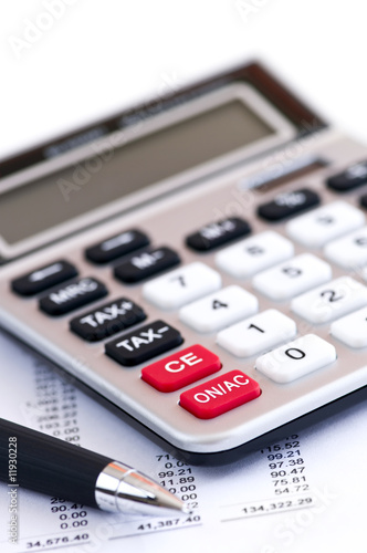 Photo: Tax calculator and pen Tax calculator and pen