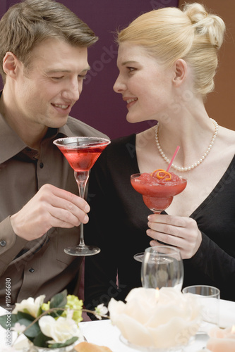 Photo: couple with drinks at romantic meal couple with drinks at romantic meal
