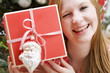 woman holding christmas parcel