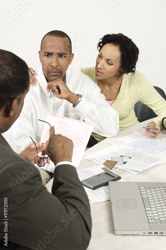 Photo: Accountant Giving Bad News Accountant Giving Bad News