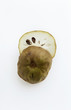 halved cherimoya on white