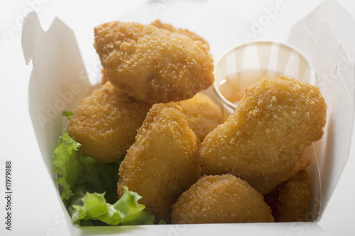 Photo: chicken nuggets with sweet and sour sauce to take away chicken nuggets with sweet and sour sauce to take away