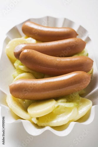 Photo: sausages on potato salad sausages on potato salad