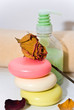 Soap and dry rose petals on a bath towel background. Soap and dry rose petals on a bath towel background.