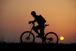 mountain biker silhouette in sunrise