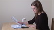 Close-up of serious woman calculating