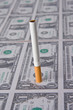 cigarette laying on money