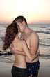 Romantic couple kissing at seaside
