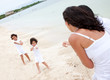 Beach family pulling a rope