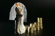 wedding couple figurine and golden coins