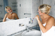 girl in bathroom with toothbrush