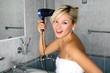 girl in bathroom with drier