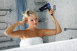 girl in bathroom with drier