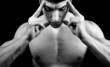 Meditation concept - muscular man in deep concentration