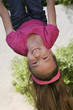 Little Girl Hanging Upside Down