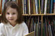 Little Girl Reading in the Library