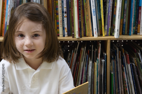 Photo: Little Girl Reading in the Library Little Girl Reading in the Library