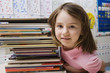 Little Girl with a Stack of Books