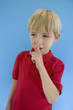 Boy with Finger on Lips