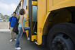 Teenage Girl Getting on School Bus