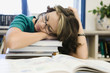 High School Student Sleeping in Library