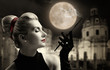 Beautiful young lady smoking. Old city behind her.