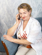 The mature woman with phone