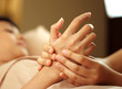 A woman getting manicure at a day spa