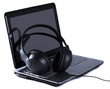 Headphones and laptop on white background Headphones and laptop on white background